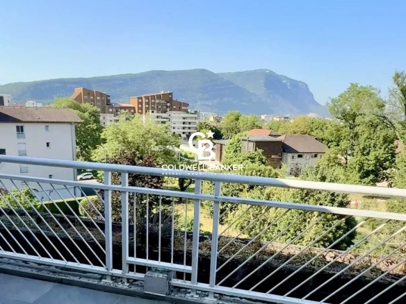 View from an apartment terrace with mountains in the background.
