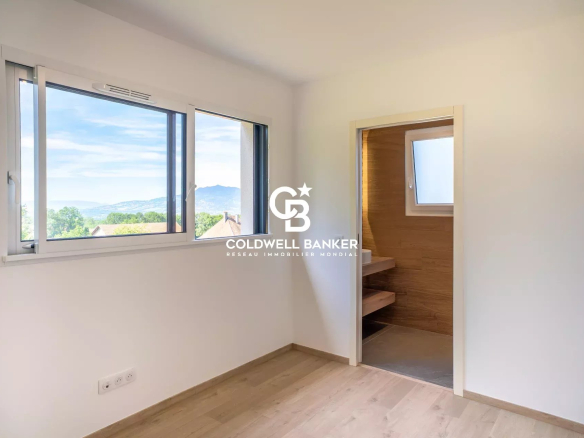 Interior of a new house with windows offering a view of nature.