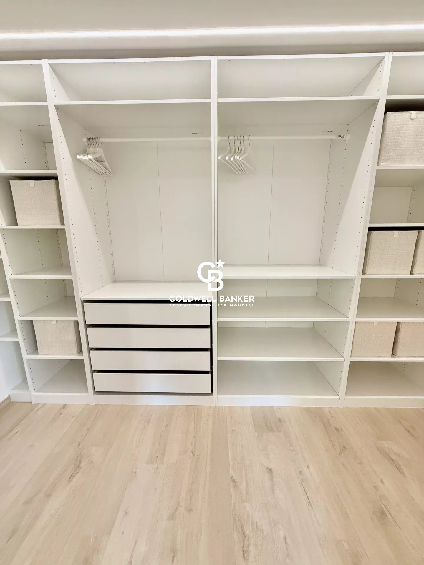 Modern dressing room in Etaux Interior of a modern dressing room with shelves and drawers, house for sale in Etaux.