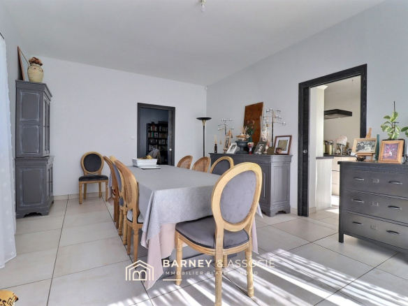 Dining room of a contemporary house with a large table and wooden chairs in Bois-Guillaume.
