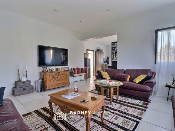 Interior of a contemporary house with a spacious living room and television, modern and bright furniture.