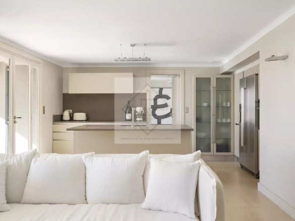 Interior of a spacious villa in Cannes with a modern kitchen and bright living room.
