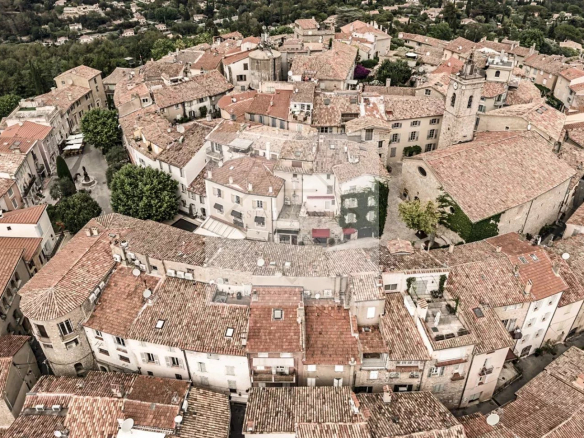 Aerial view of the medieval village of Mougins with its tiled roofs and narrow streets.