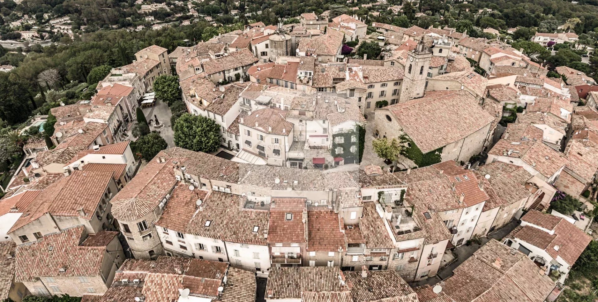 Aerial view of Mougins Aerial view of the medieval village of Mougins with its tiled roofs and narrow streets.