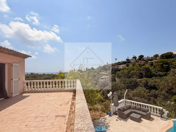 Unobstructed sea view from a villa in Antibes, with stone terrace and surrounding nature.