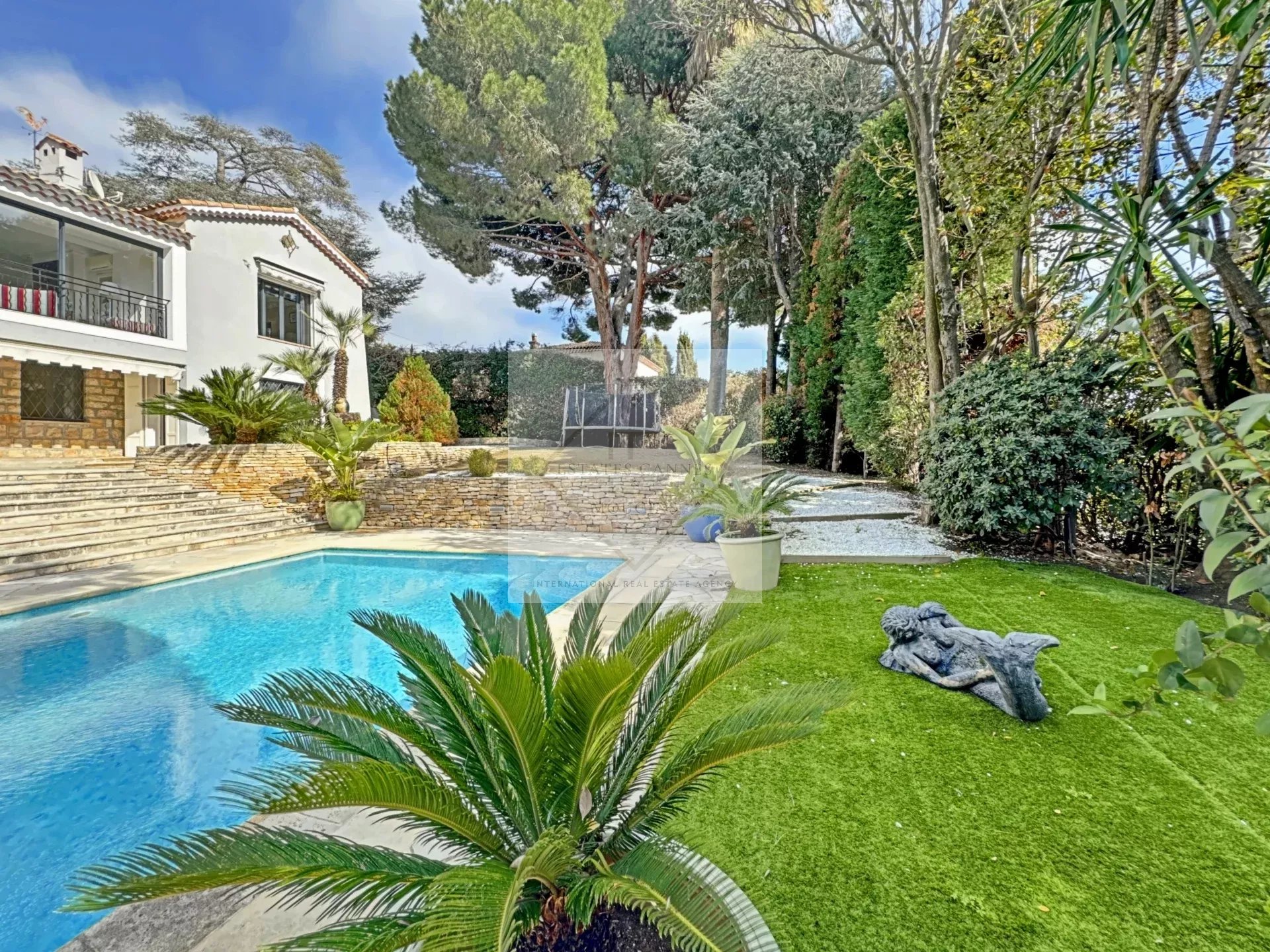 Luxury villa with pool and garden in Cannes, California.