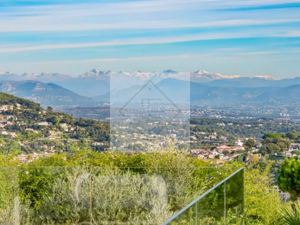 Panoramic views of the mountains and the sea from a contemporary villa in Super Cannes.