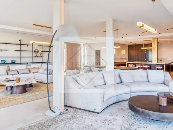Interior of a contemporary villa in Super Cannes with a spacious living room and open kitchen.