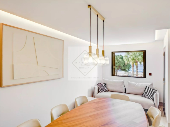 Interior of a modern apartment with sea views in Cannes, bright dining room and living room.