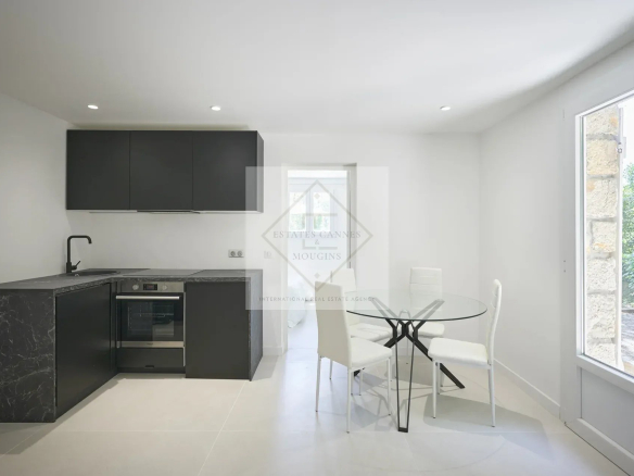 Modern kitchen with dining table and chairs in a villa in Mougins.