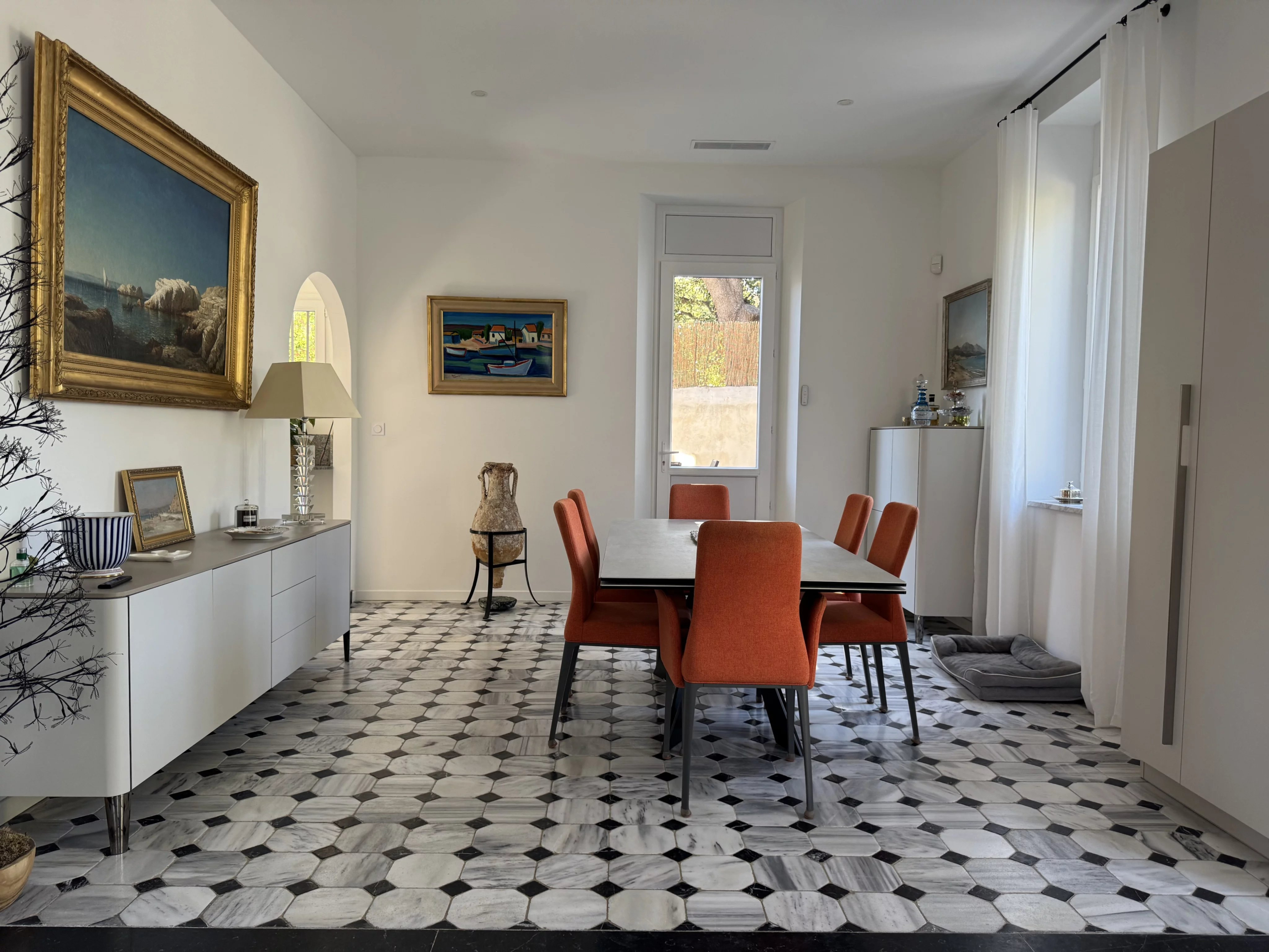 Interior of a renovated bastide with dining room and modern decor in Marseille.