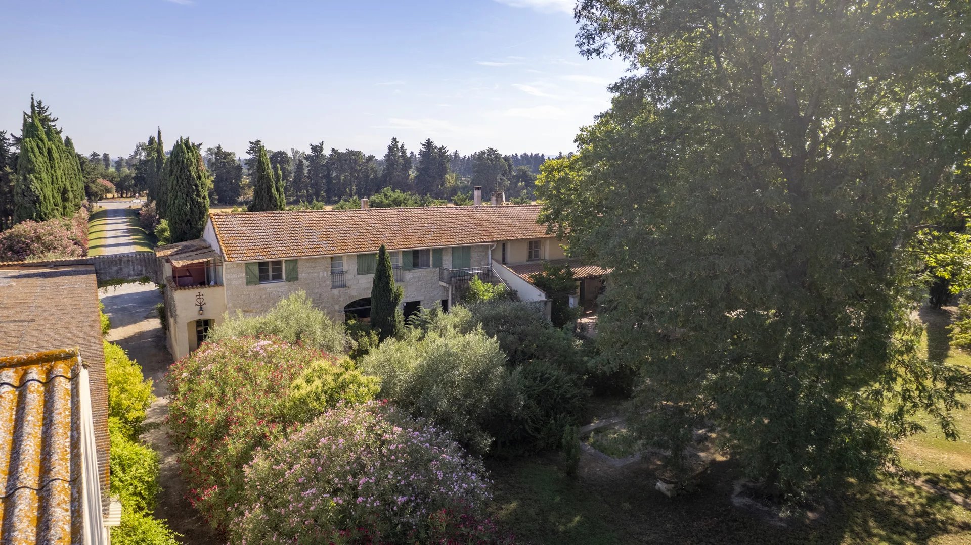 Exceptional property in Fourques Aerial view of a property with several buildings and a landscaped park in Fourques.