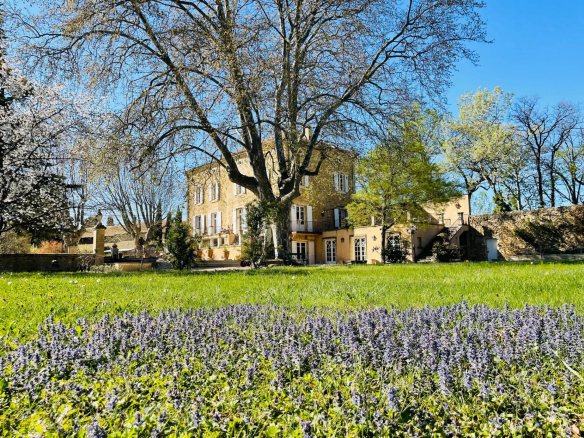 19th century Provençal country house with flower garden and trees, located in Orange, Côtes du Rhône.