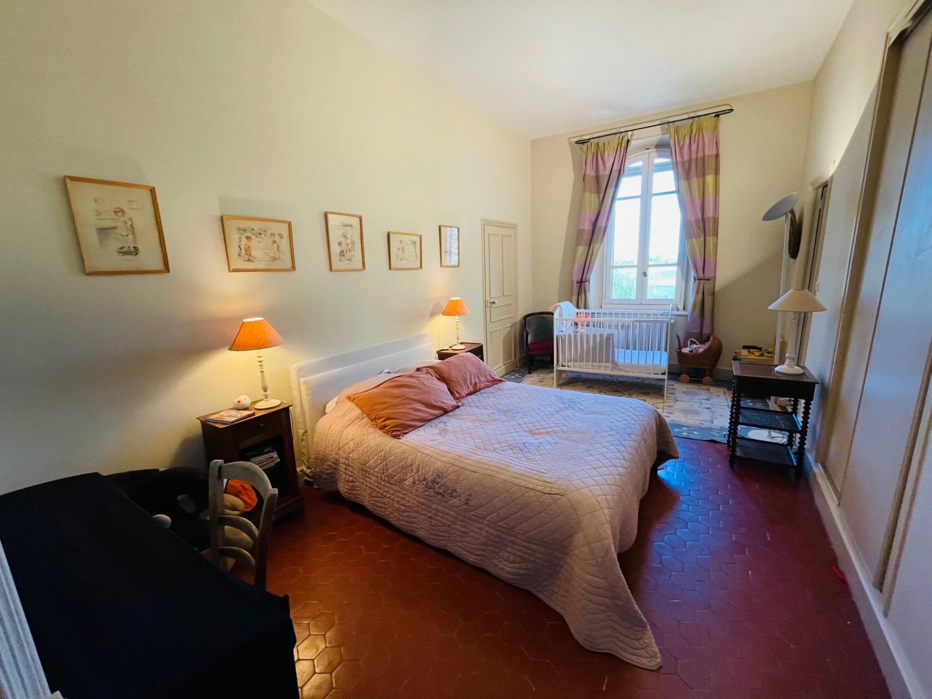 Room in a Provençal country house Room in a Provençal country house with bed, lamps and windows illuminating the space.