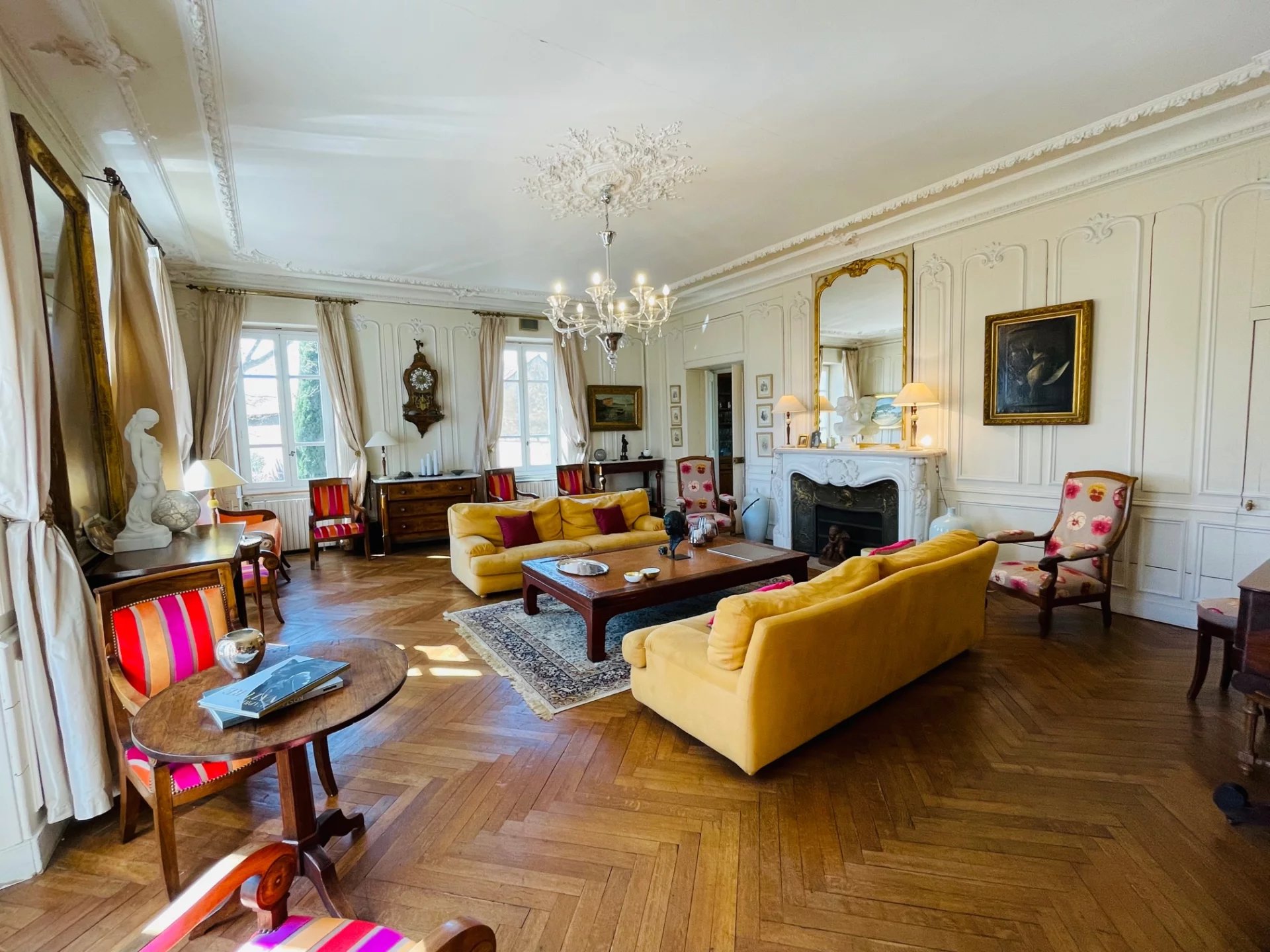 Living room of a Provençal country house Interior of a Provençal country house with a spacious living room, yellow sofas and elegant decor.
