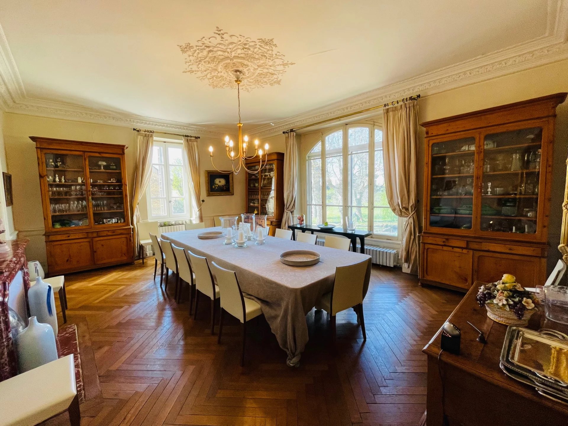 Dining room of the Provençal country house Dining room of a Provençal country house with large windows and wooden furniture.