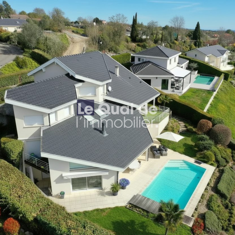 A modern white villa with a dark tiled roof and a rectangular turquoise pool in a landscaped hillside yard in bright daylight, aerial view.