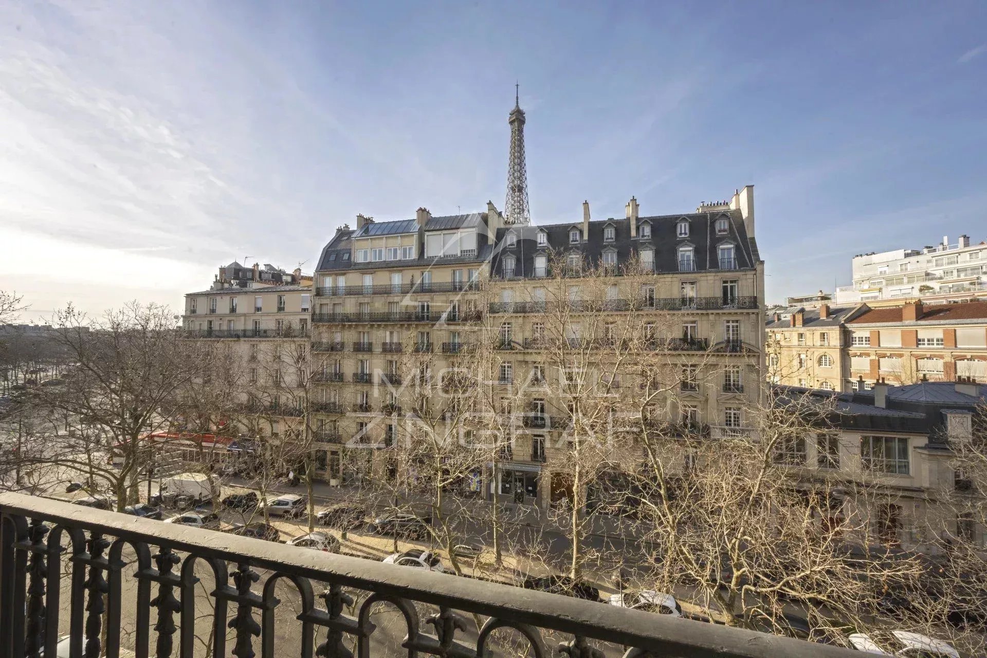 View from an apartment on Avenue Rapp in Paris View of an old building in Paris with the Eiffel Tower in the background.