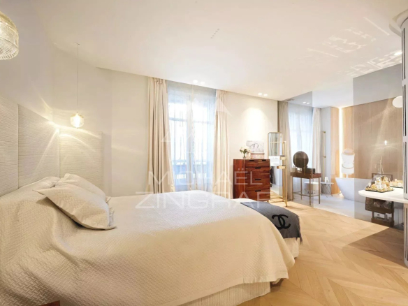 Room in a modern apartment with bed and elegant decor in Paris 7th arrondissement.