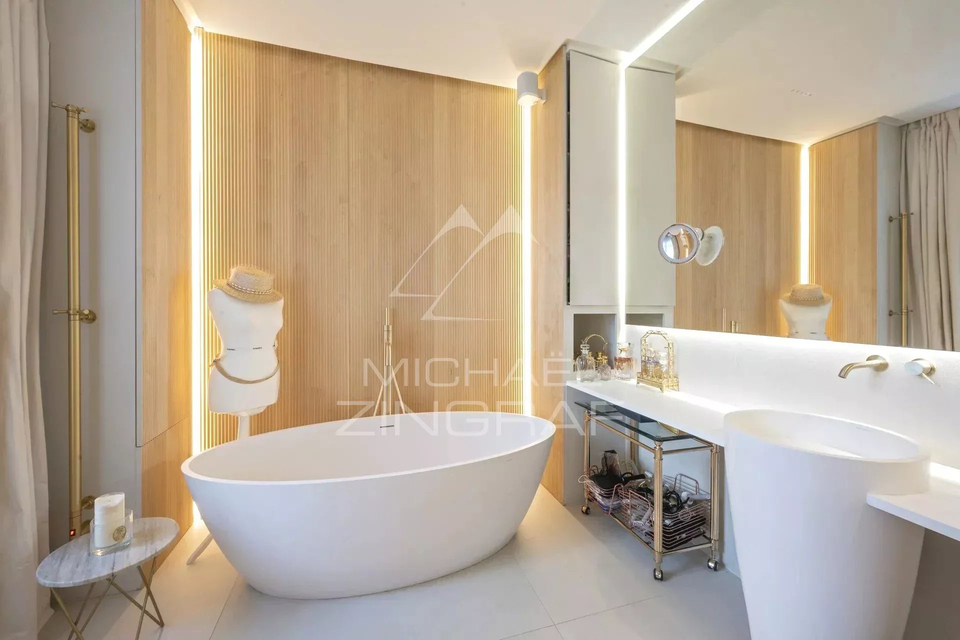 Bathroom of an apartment in the 7th arrondissement of Paris Modern bathroom with freestanding bathtub and elegant furniture.