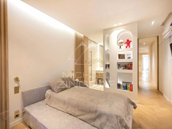 Room in a modern apartment in Paris with a single bed and contemporary decor.