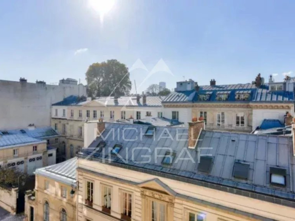 Unobstructed view over Parisian rooftops from a 4th floor apartment in Paris 7th arrondissement.