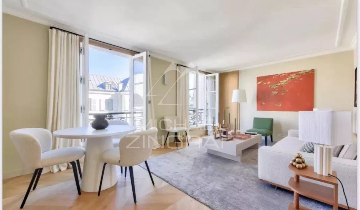 Furnished apartment in Paris 7th arrondissement Interior of a furnished apartment in Paris, bright living room with dining table and sofa.