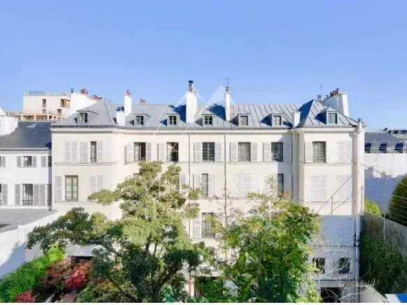 View of an old building in Paris, rue Las Cases, with gardens below.