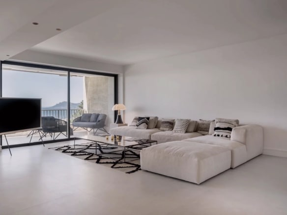 Interior of a modern apartment with a spacious living room and sea view in Cannes.