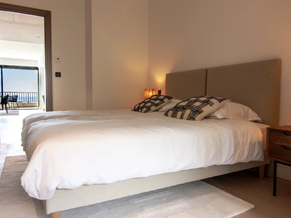 Room in a luxury apartment in Cannes with a double bed and modern decor.