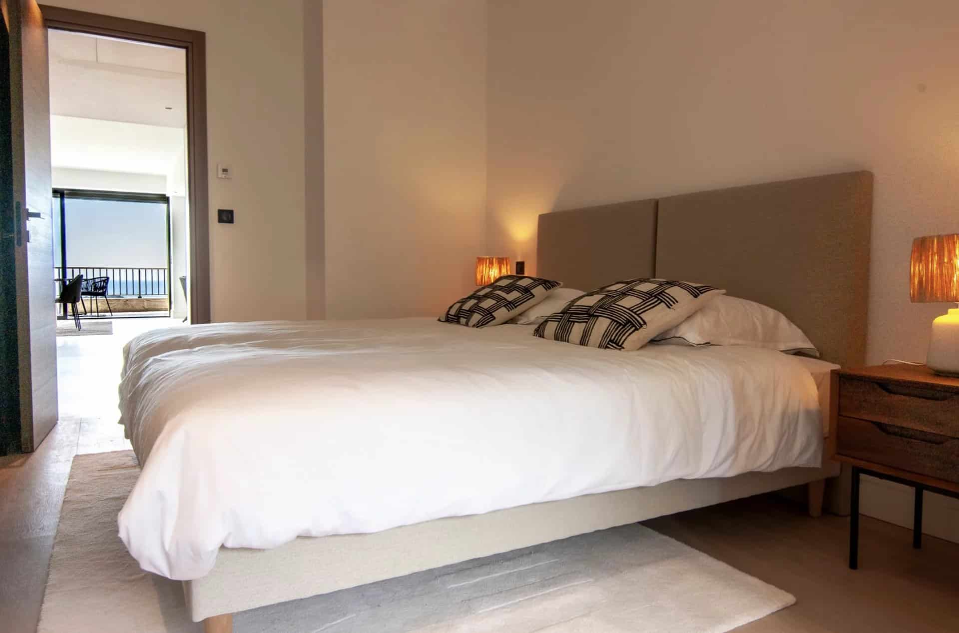 Room in a luxury apartment in Cannes with a double bed and modern decor.