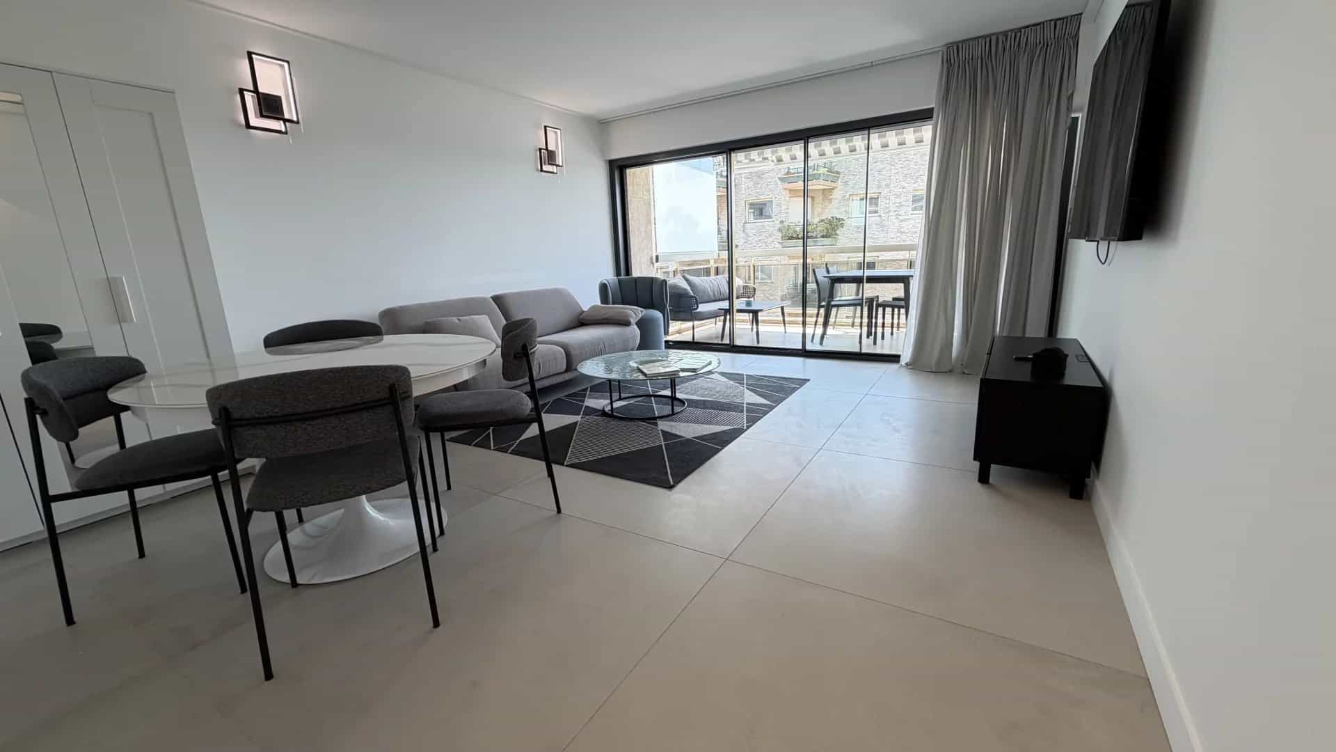Bright apartment in Cannes Interior of a bright 3-room apartment with living room, dining room and terrace in Cannes.