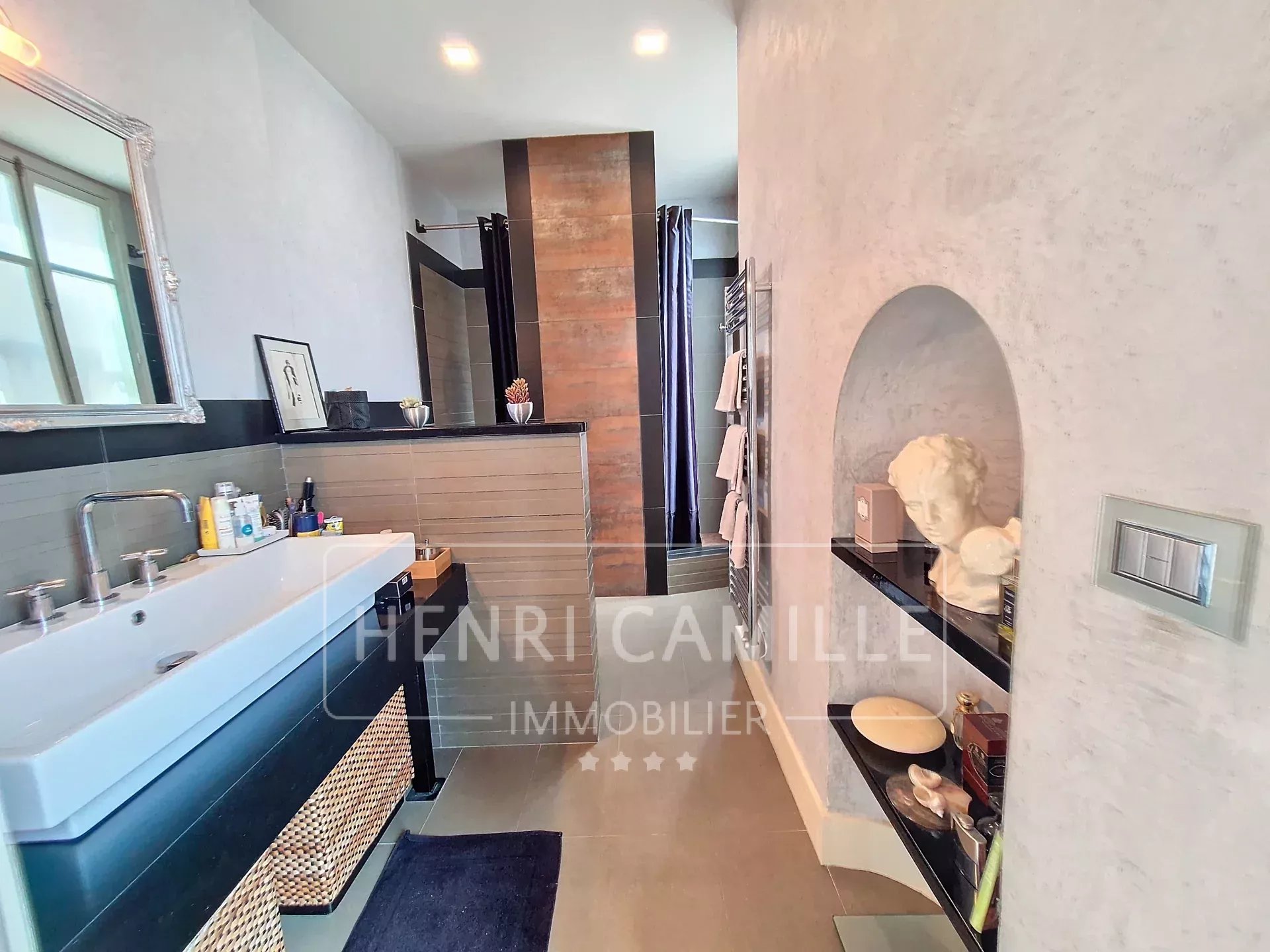 Modern bathroom with bathtub and contemporary decor.