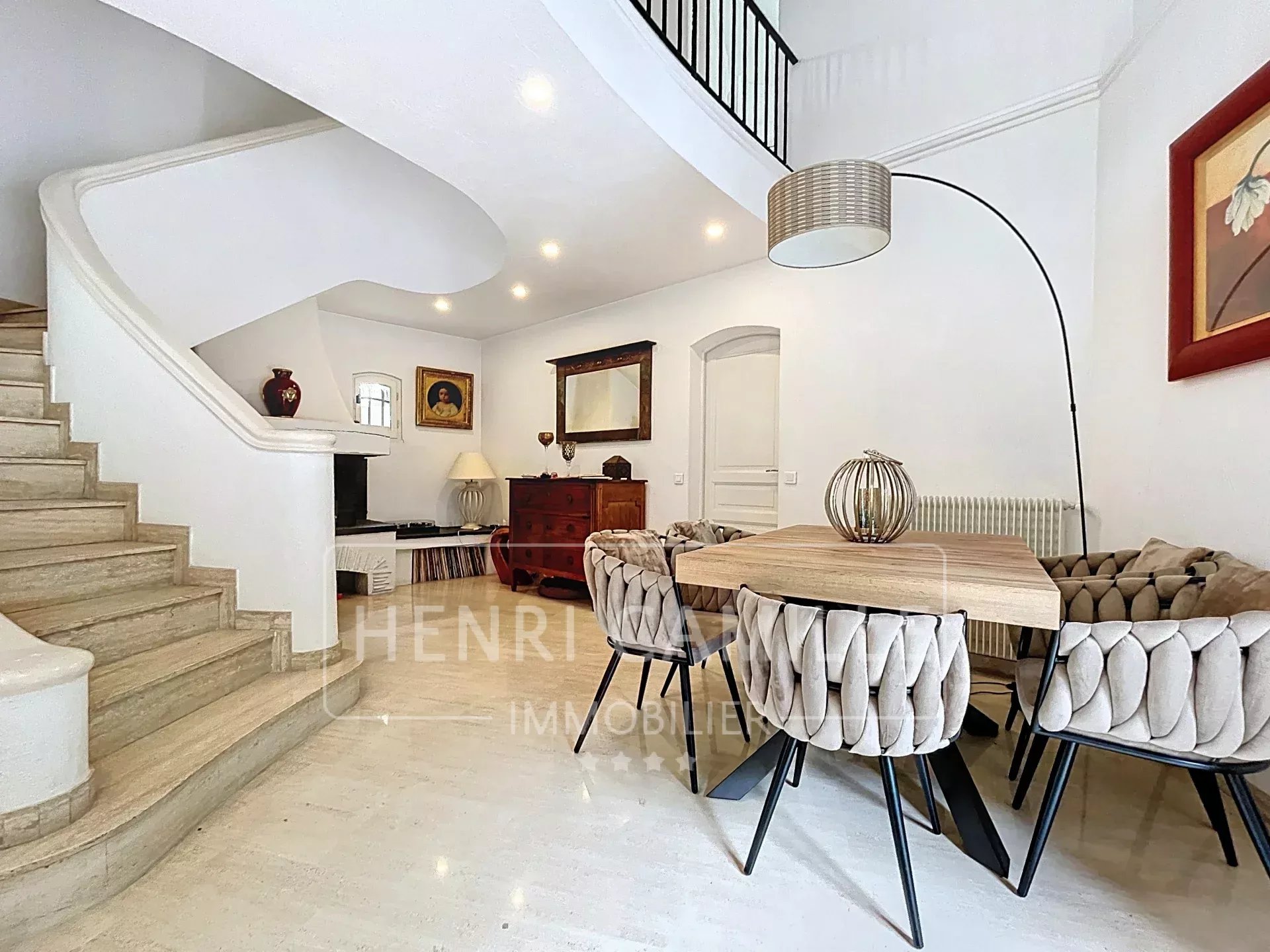 Interior of a villa in Cannes Interior of a villa in Cannes Petit Juas with a modern living room and dining room.