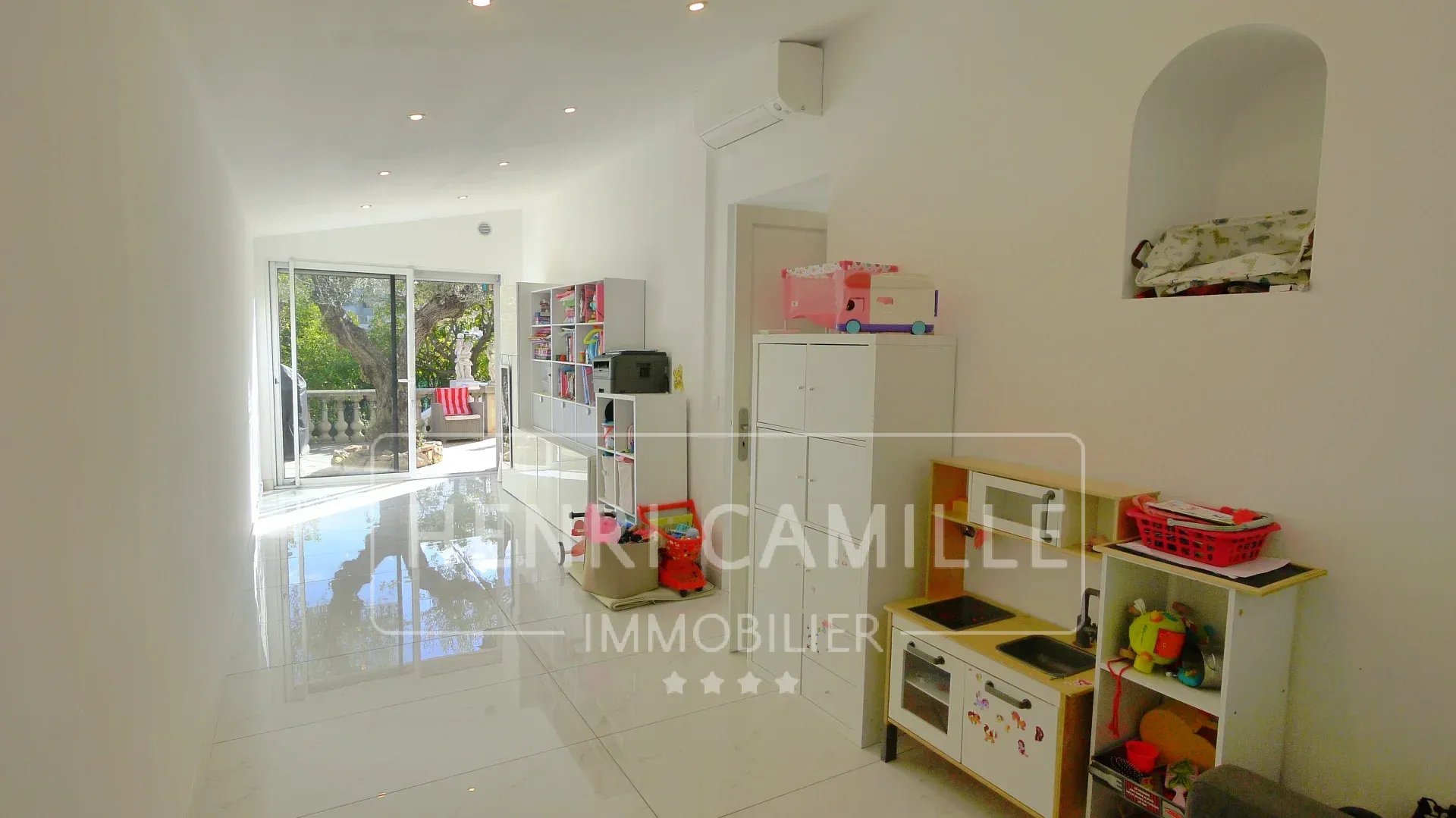 Interior of a villa in Cannes Petit Juas with a bright hallway and storage.