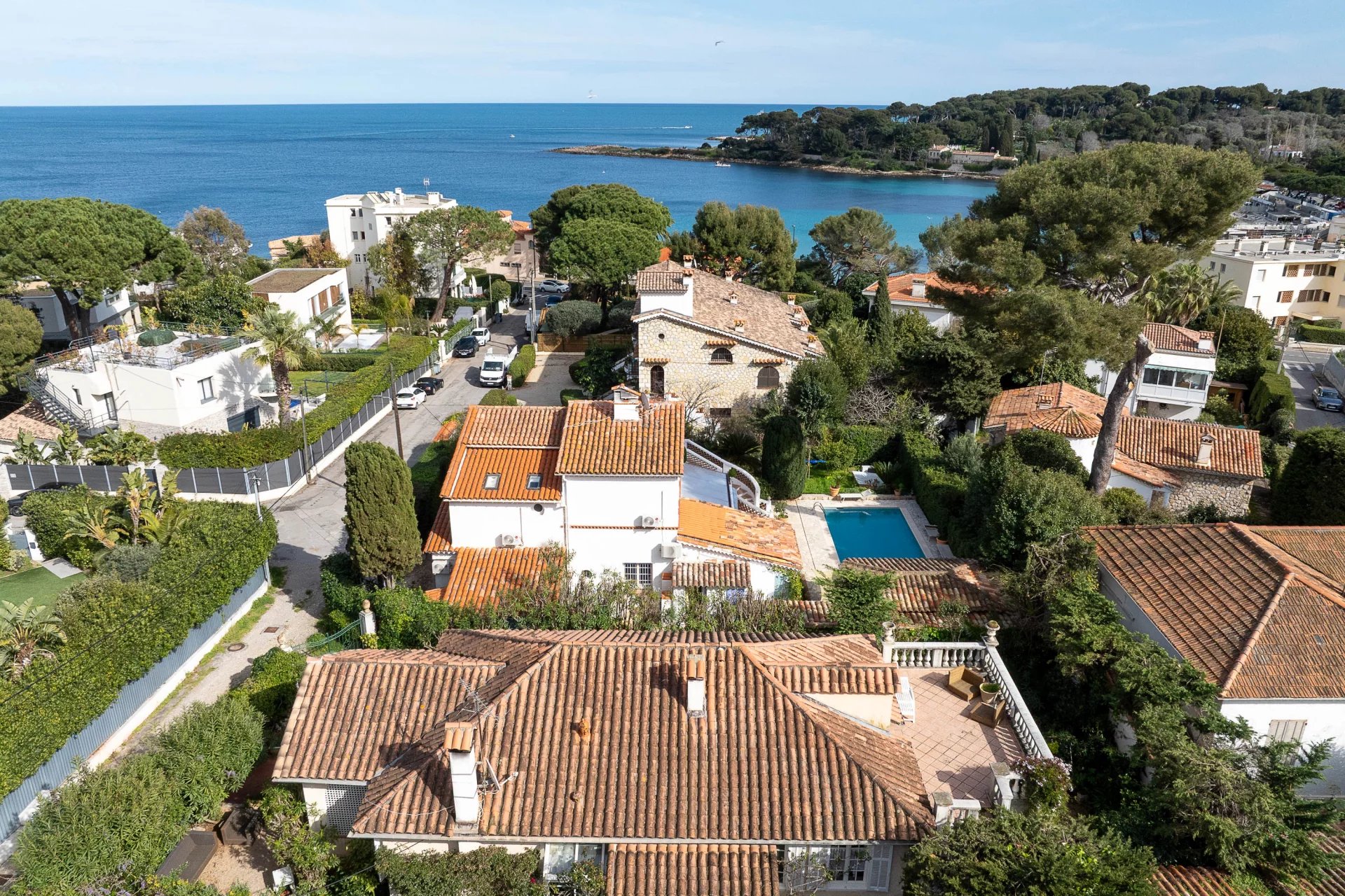 Aerial view of a villa with swimming pool in Cap d'Antibes, near the sea.