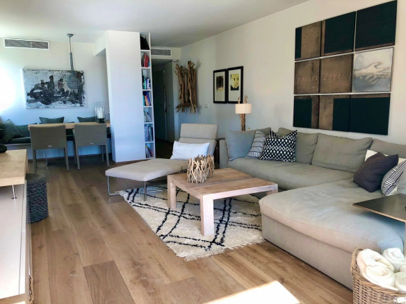 Bright living room of a 3-room apartment with modern furniture and tasteful decor.