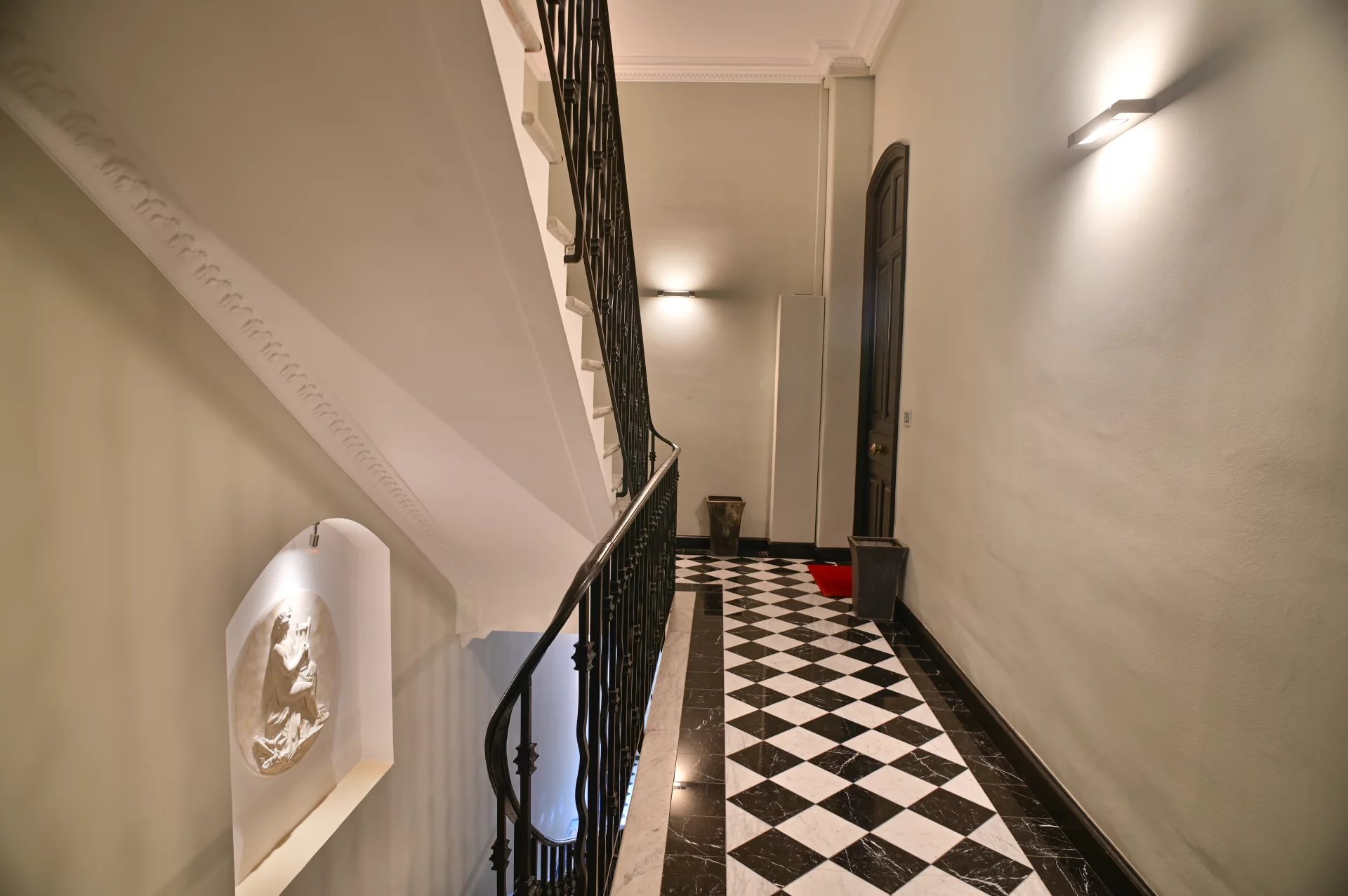 Staircase of a Belle Époque building Staircase of a Belle Époque building in Cannes with a black and white checkered floor.
