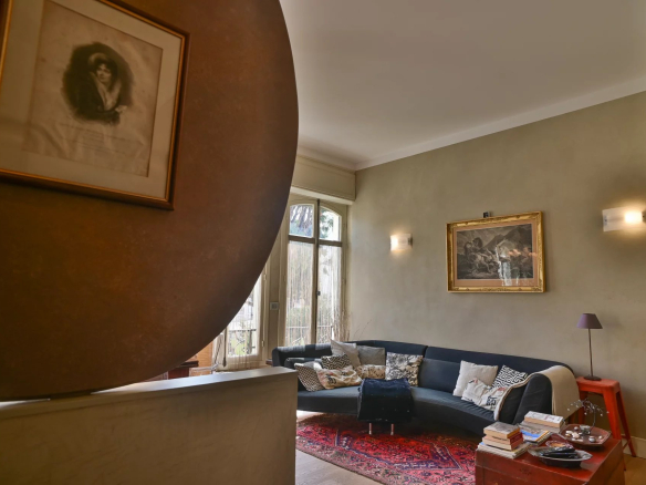 Interior of a Belle Époque apartment in Cannes with an elegant living room and contemporary elements.