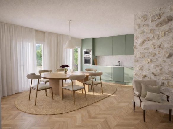 Intérieur d'un appartement rénové avec cuisine moderne et salle à manger, fenêtres lumineuses.