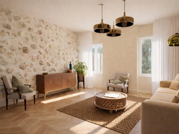 Salon d'un appartement rénové avec murs en pierre, mobilier contemporain et lumière naturelle à Antibes.