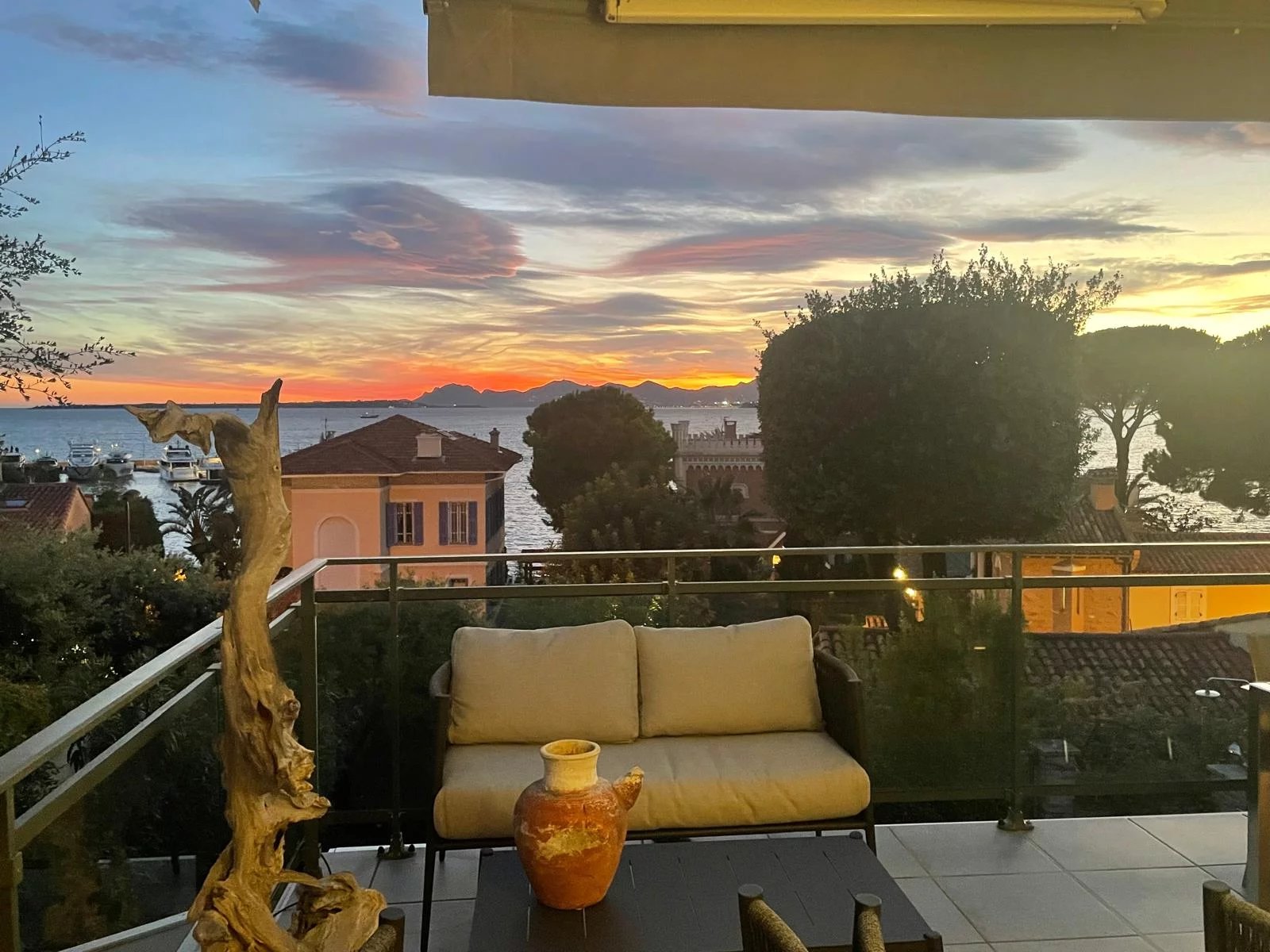 Sea view at Cap d'Antibes Terrace of an apartment with sea view in Cap d'Antibes, colorful sky at sunset.
