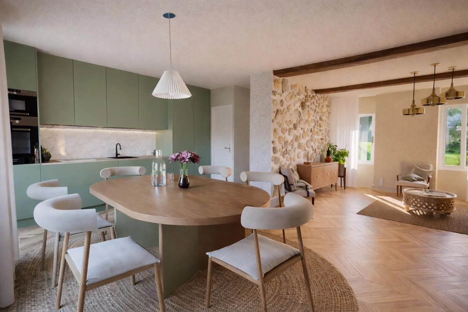 Appartement rénové à Antibes Intérieur d'un appartement rénové avec cuisine moderne et coin repas, lumière naturelle abondante.