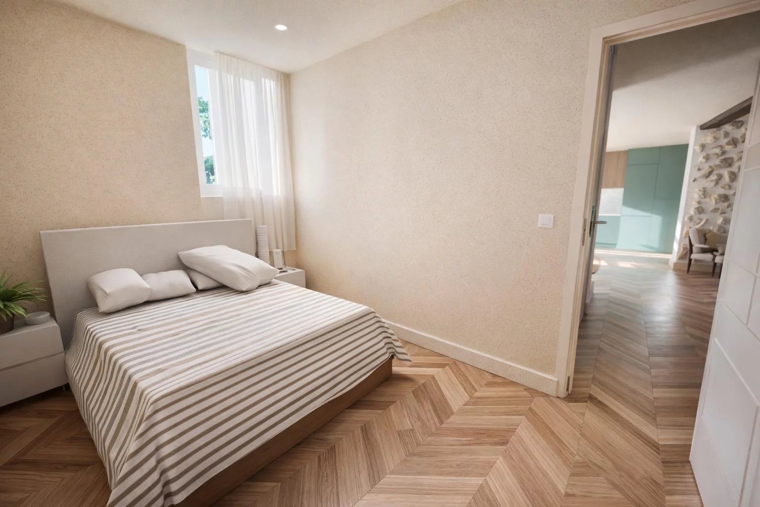 Chambre d’appartement rénové à Antibes Chambre d'un appartement rénové à Antibes avec parquet et lumière naturelle.