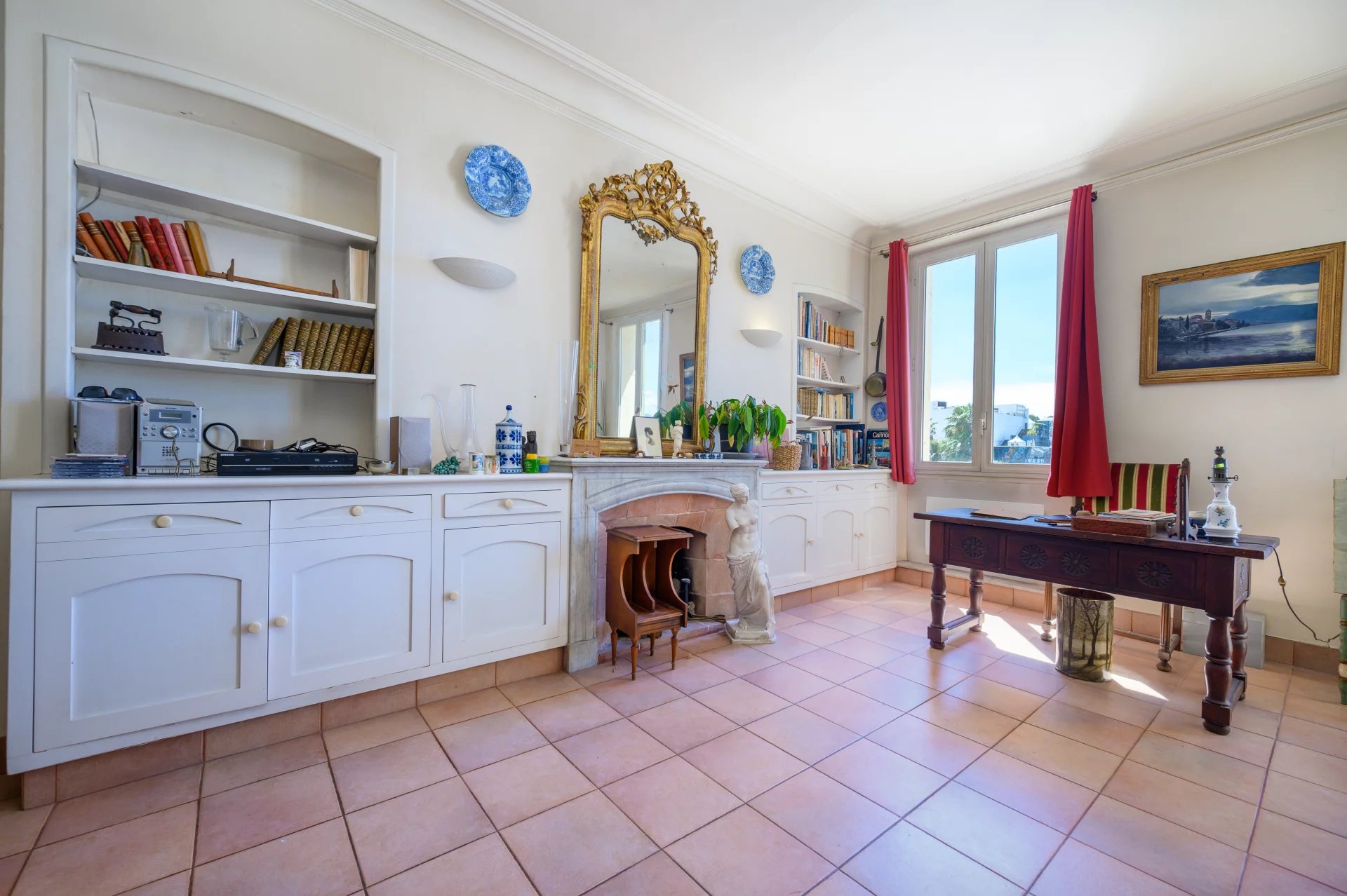 3-room apartment in Cannes Interior of a 3-room apartment with classic furniture and a view of the Old Port of Cannes.