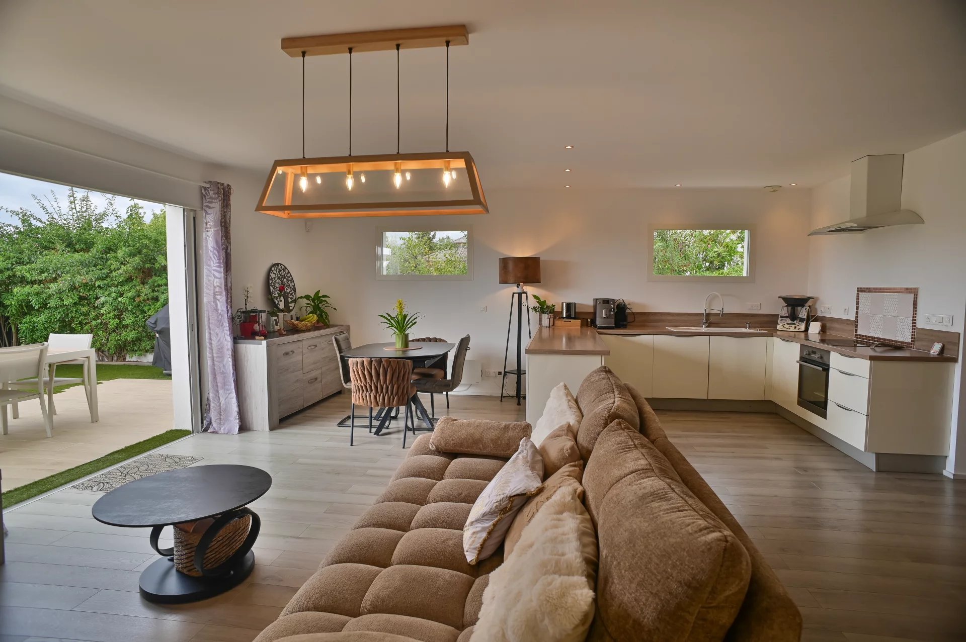 Interior of a villa in Villeneuve-Loubet Interior of a contemporary villa with a bright living room and open kitchen.