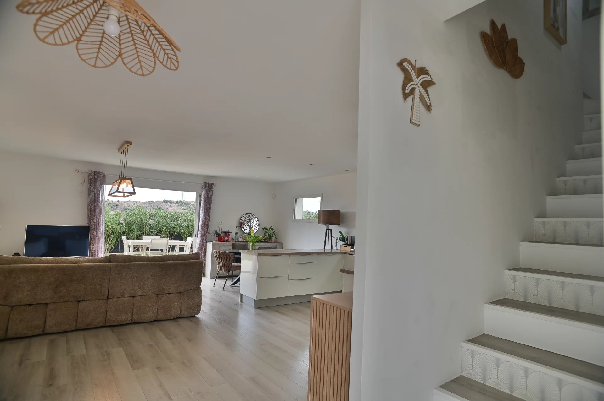 Interior of a contemporary villa Interior of a contemporary villa with bright living room and staircase, Villeneuve-Loubet.