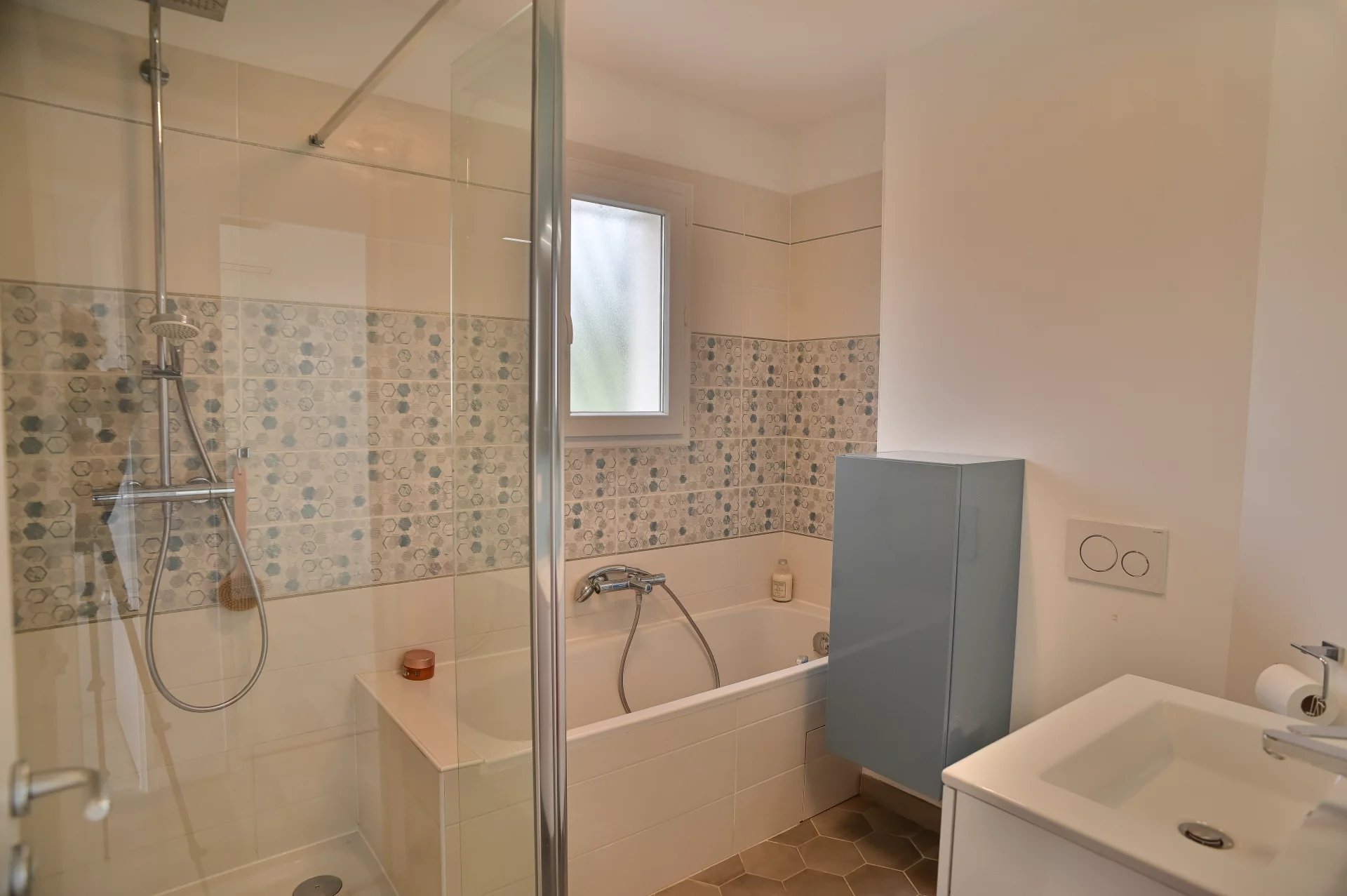 Contemporary bathroom Modern bathroom with shower and bathtub, tiled and decorative tiled flooring.