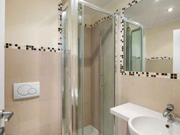 Modern bathroom with shower and sink in an apartment in Roquebrune-Cap-Martin.