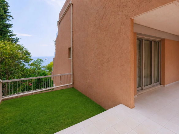 Terrace of an apartment in Roquebrune-Cap-Martin with sea and garden views.